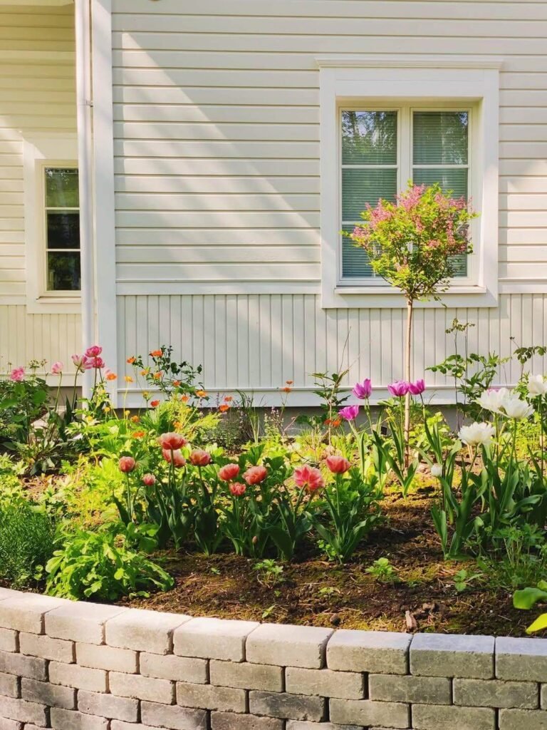 11. Brick-Edged Flower Bed for Cottage-Inspired Color