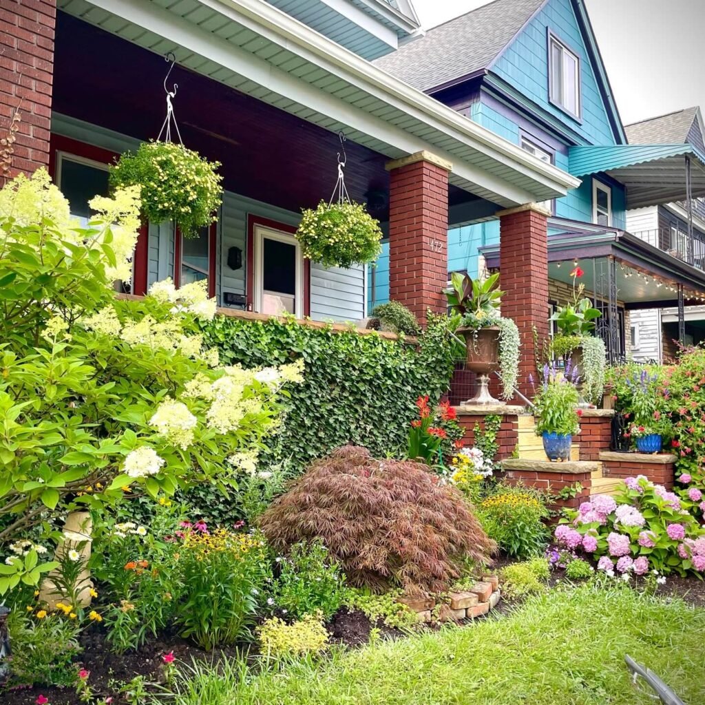 15. Eclectic Front Porch Garden with Hanging Accents