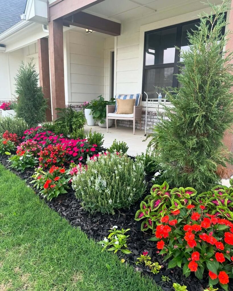 4. Front Porch Flower Bed with Bold Color Contrast