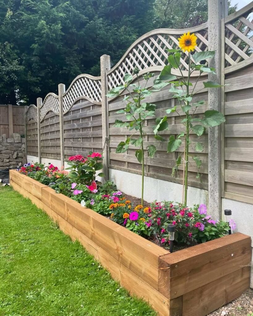7. Raised Wooden Flower Bed Bursting with Summer Color