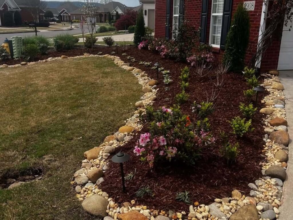 8. Rock-Edged Flower Bed for a Natural, Drought-Resistant Look