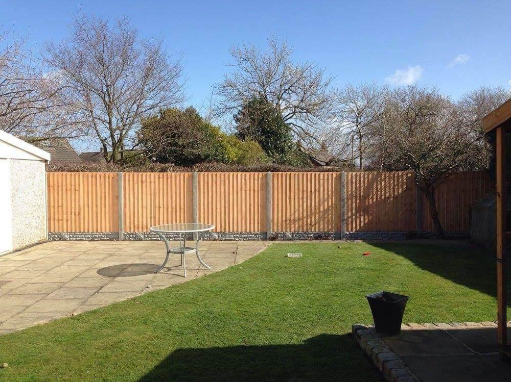 16. Practical Panel Fence with Concrete Posts for Durability