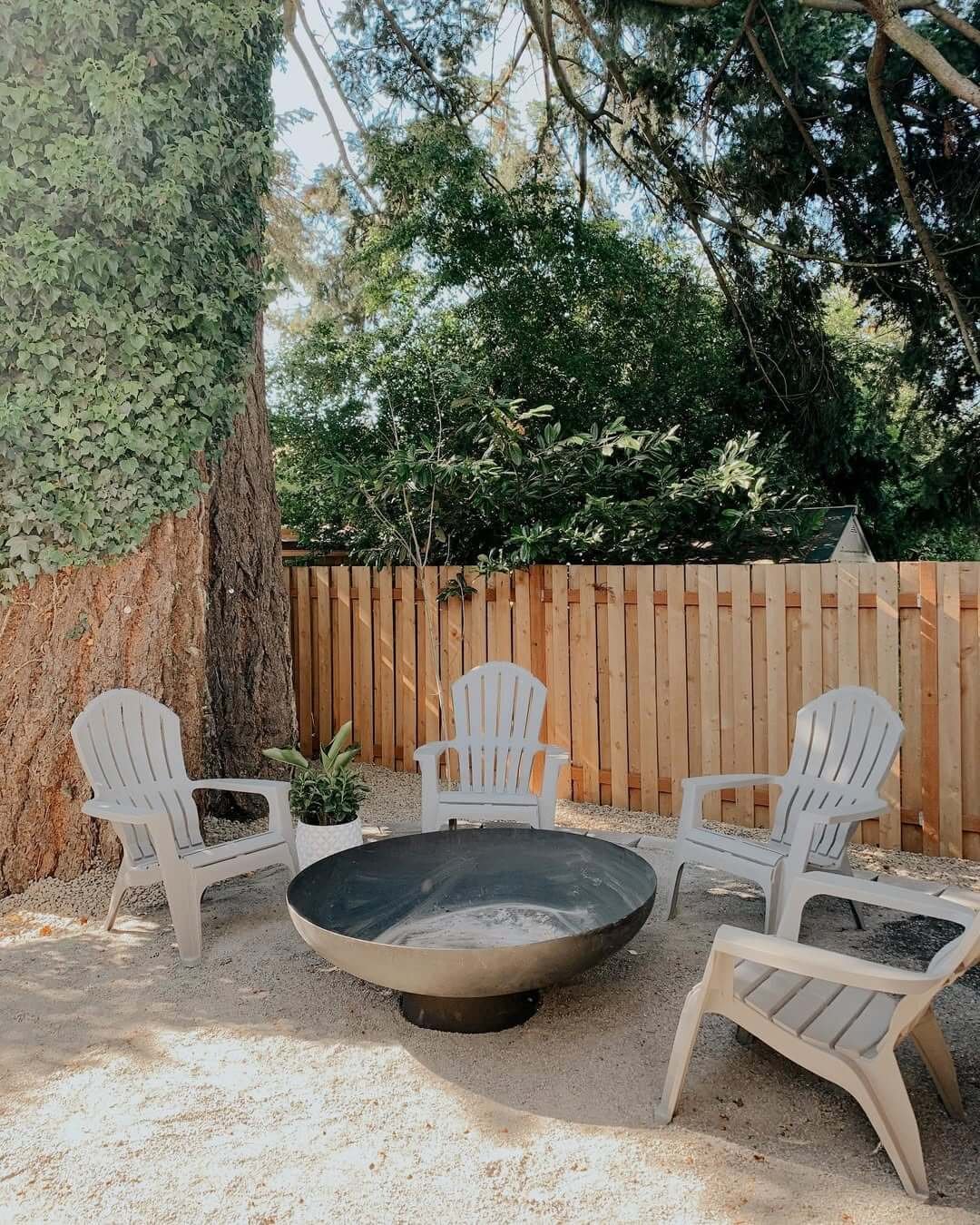 Shaded Simplicity Beneath Gravel Fire Pit 