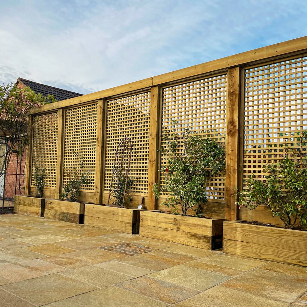 2. Lattice Fence with Raised Planters for Garden Integration