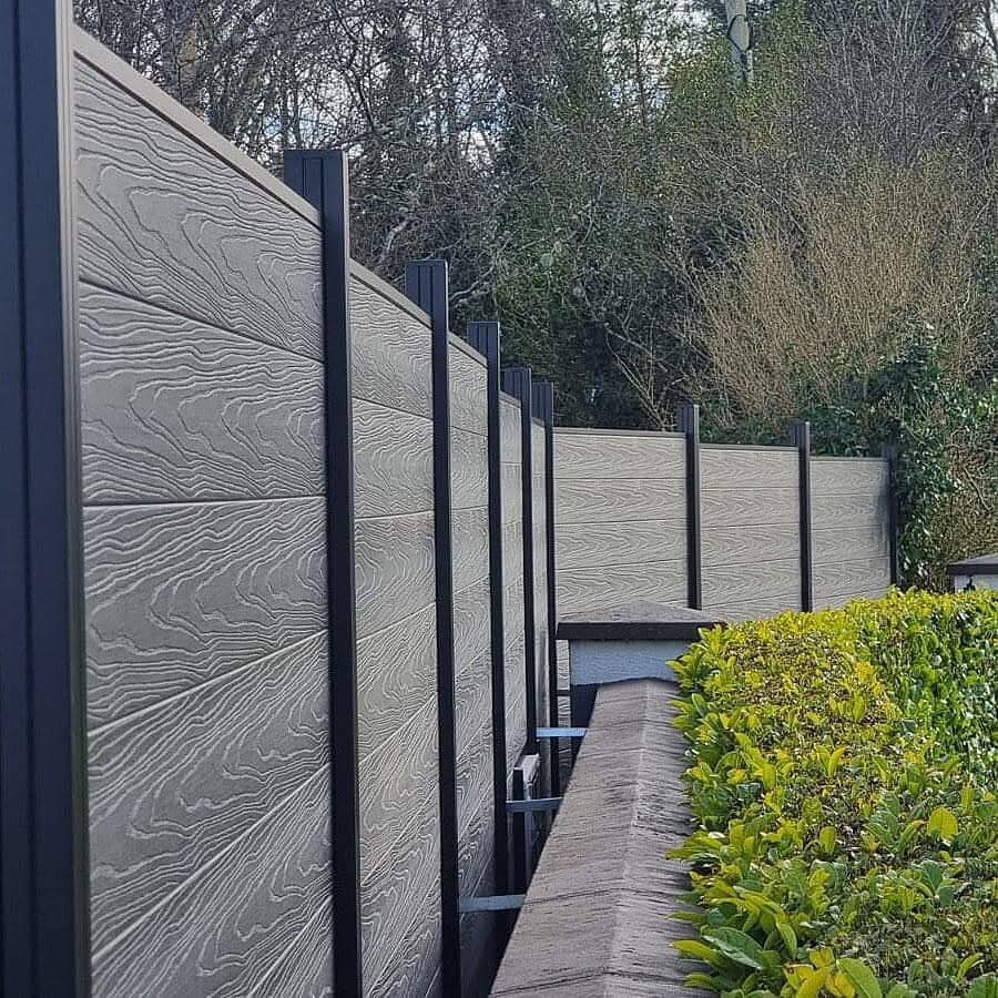 21. Composite Panel Fence for Modern, Low-Maintenance Style