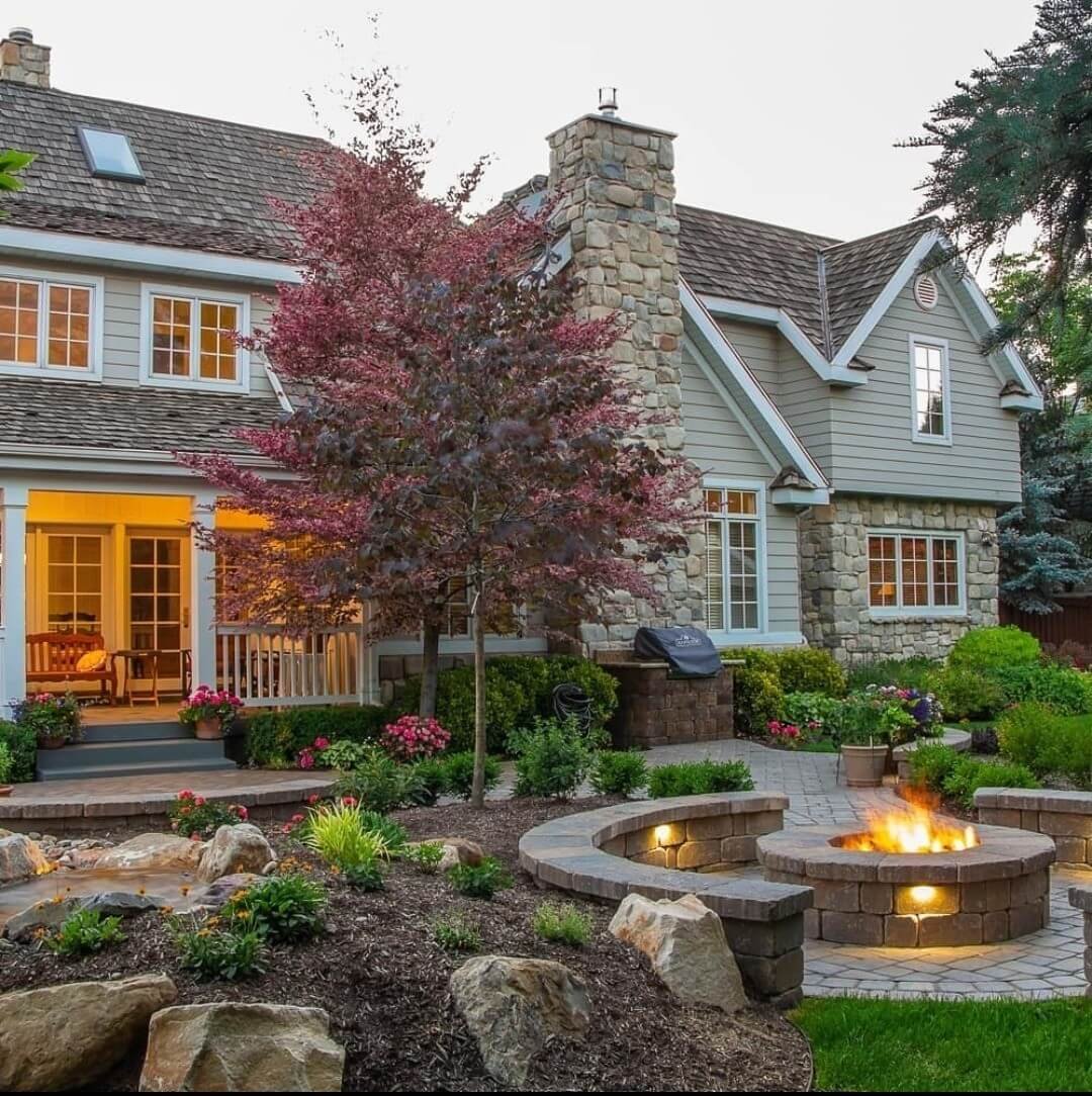 Natural Fire Pit Backyard Garden Retreat with Illuminated Stone Fire Pit