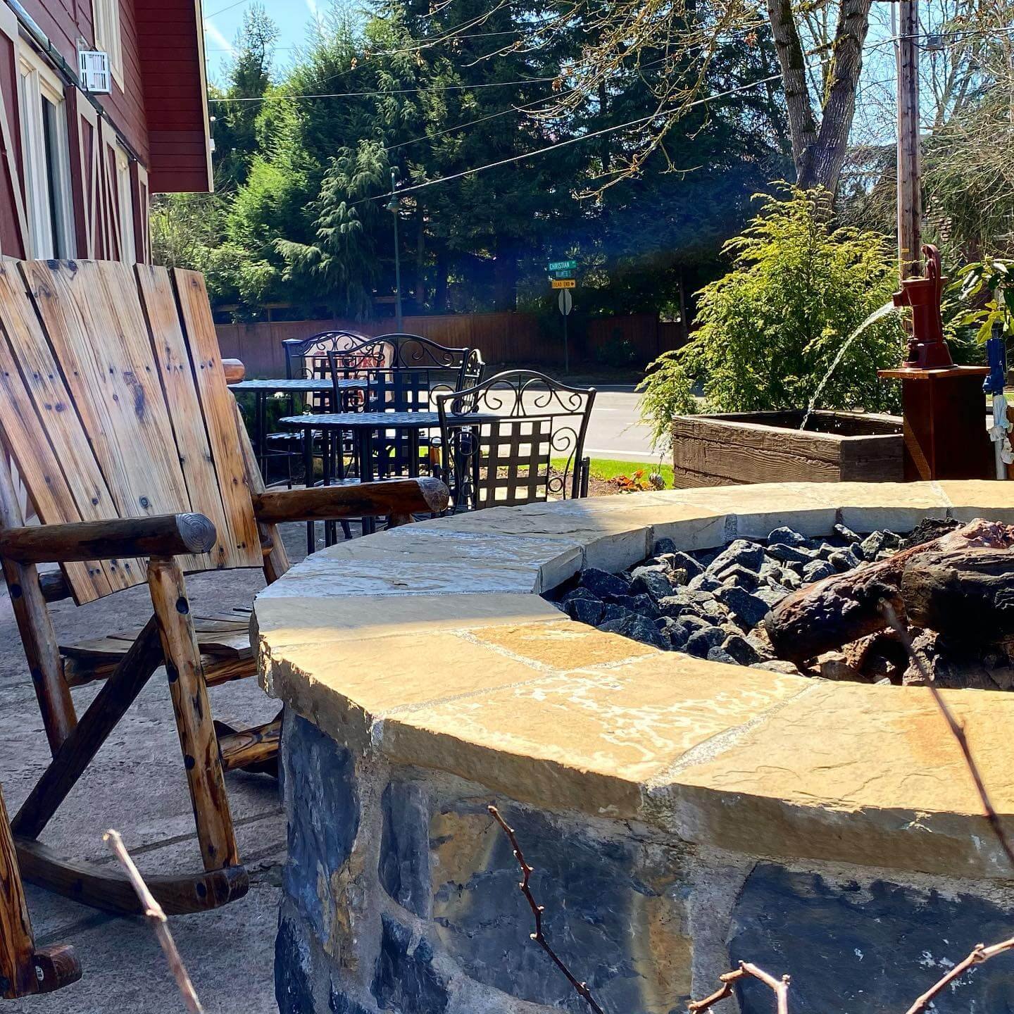  Fire Pit Seating Area Ideas Rustic Charm with Log Rockers and Stone Pit
